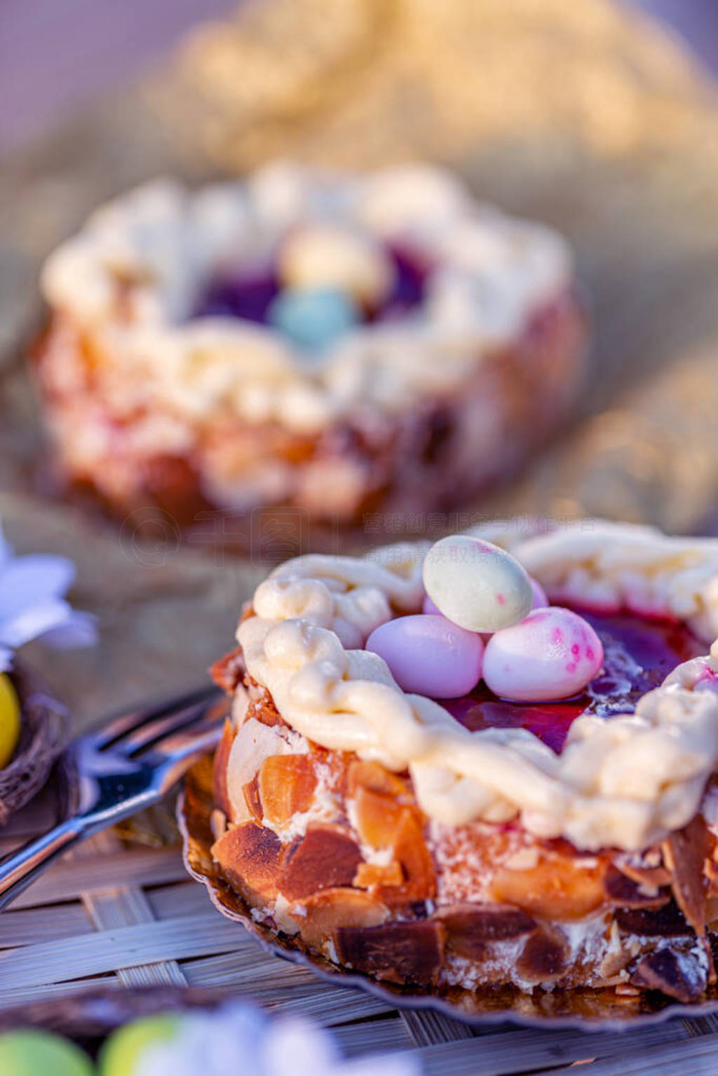 Easter Sponge cake nest. Nuts and oval sweet sweets in the form