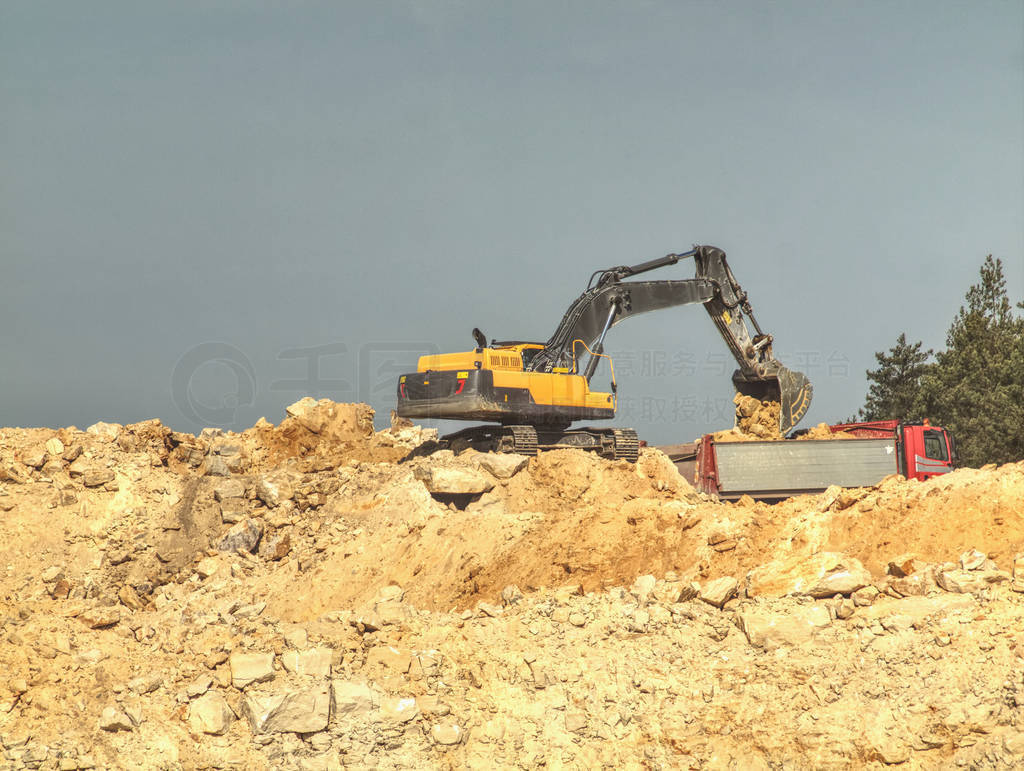 Excavator digger stone and Dump truck working on hill