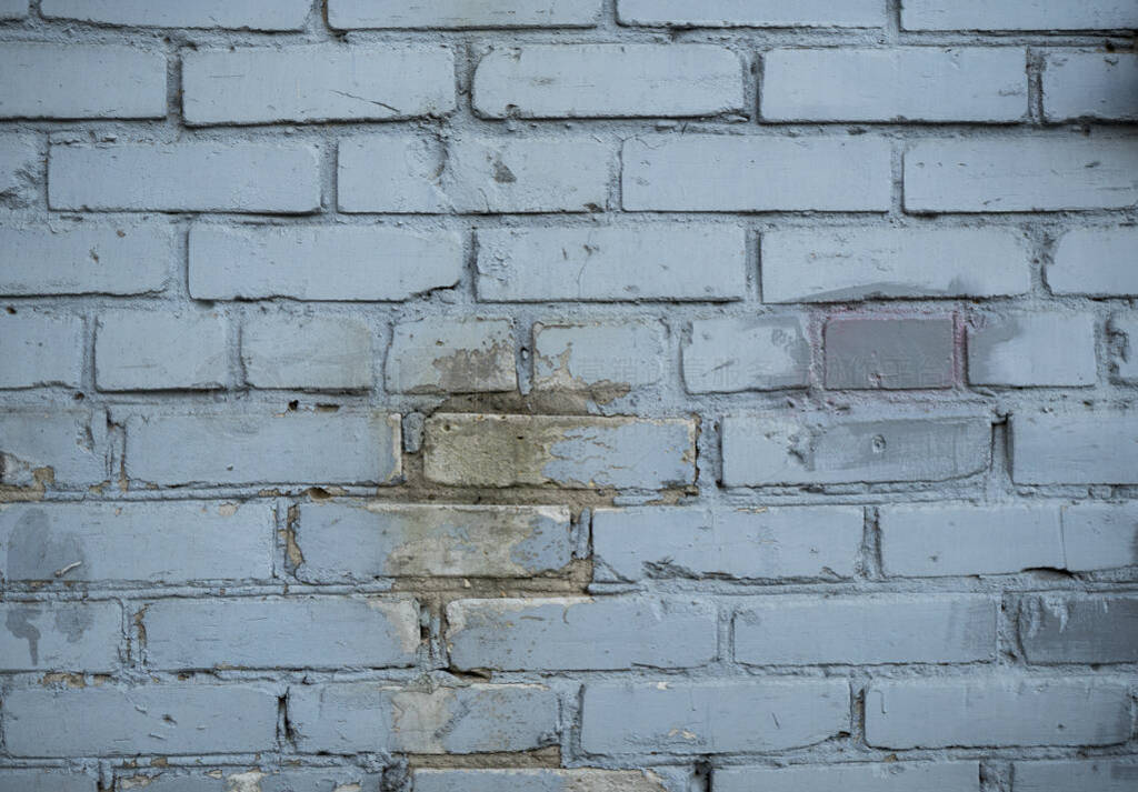 Texture of an old paint covered brick wall. Background image of