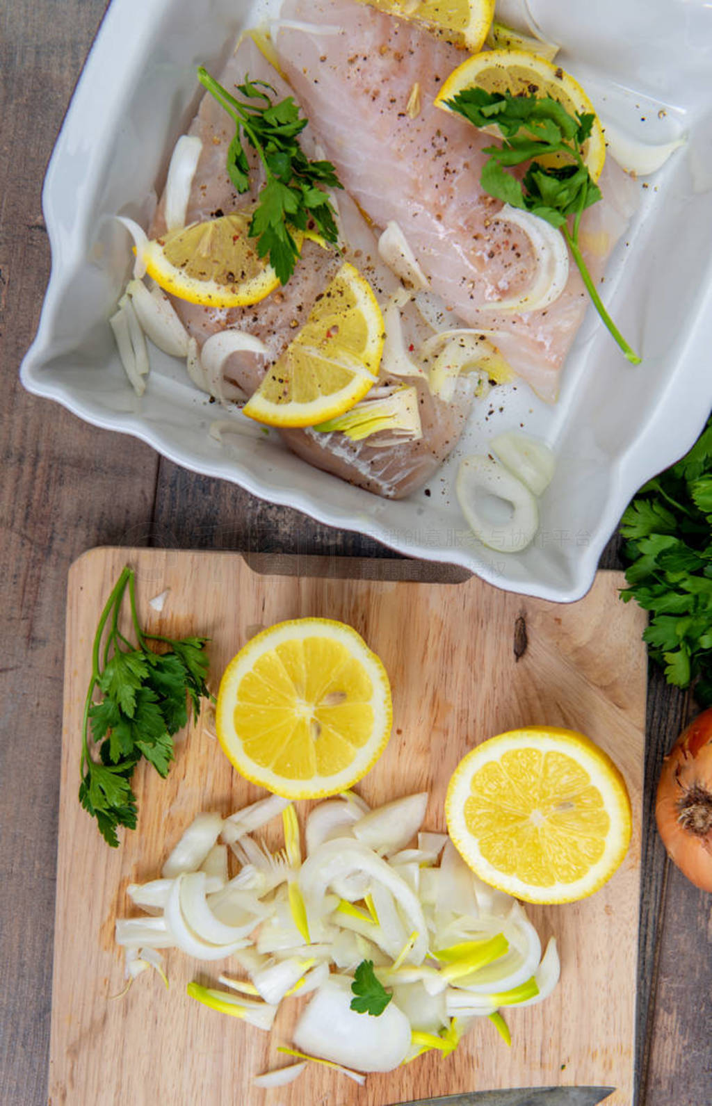 Fresh fish, raw cod fillets with addition of herbs and lemon