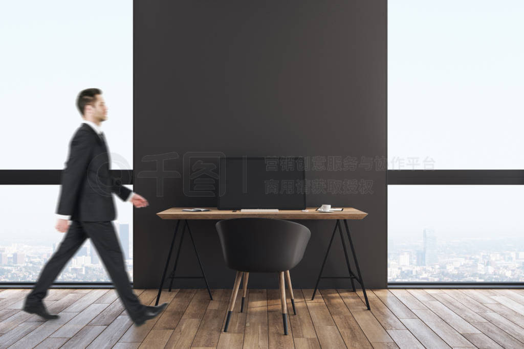 Businessman in minimalistic office interior