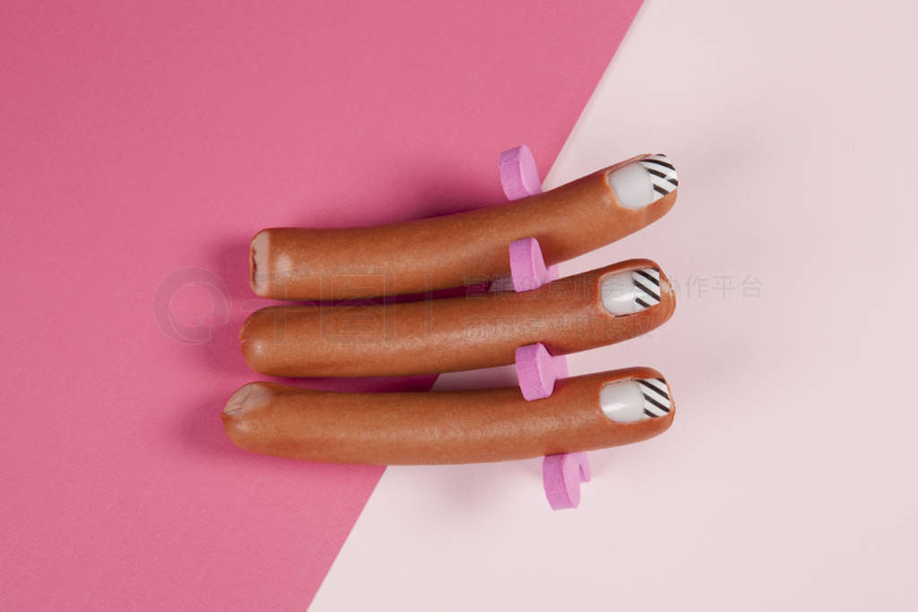 gradient pink background and sausage manicure