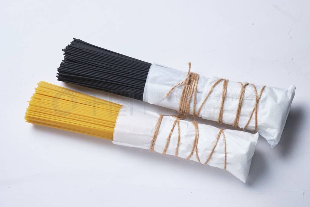 Black and white paste. Different types of spaghetti.