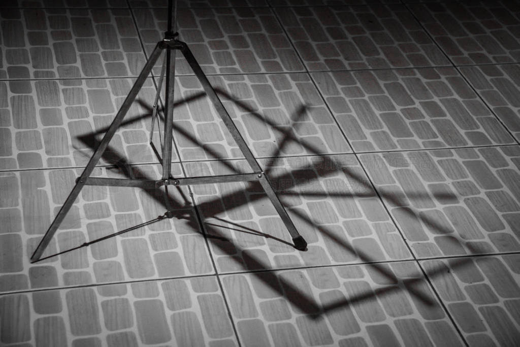 Shadow of Note stand on the floor