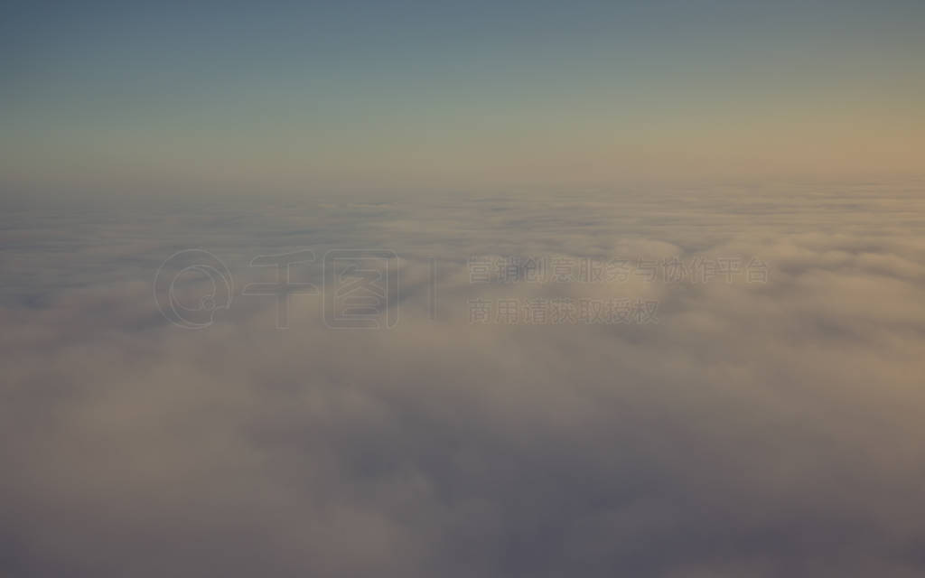 Layer of clouds taken from aircraft above scene illuminated by l