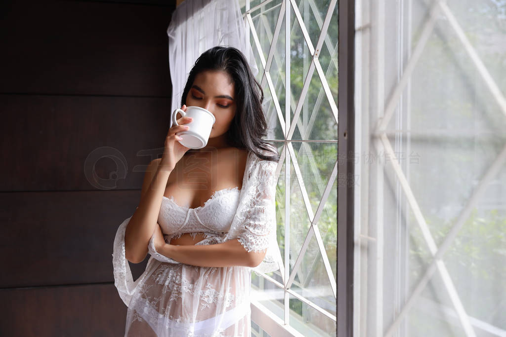 Portrait of attractive and sexy asian woman in white lingerie sl