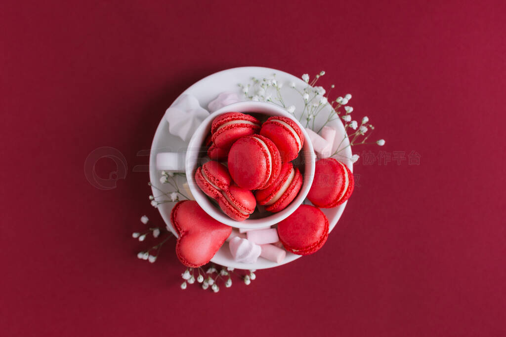 Valentine's day background with pink french heart-shaped macaron