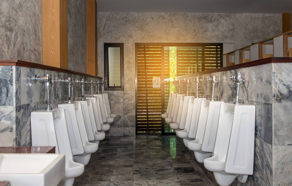 White urinal row in modern restroom interior,Urinals background