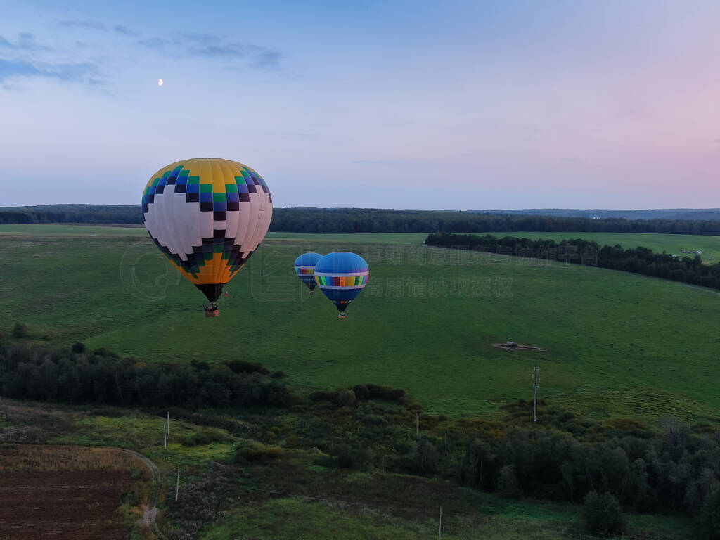 Aerial view of air balloons flights above the river.