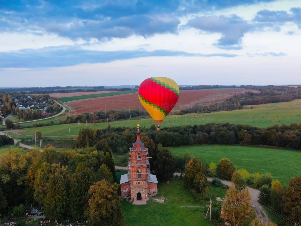 Aerial view of air balloons flights above the river.