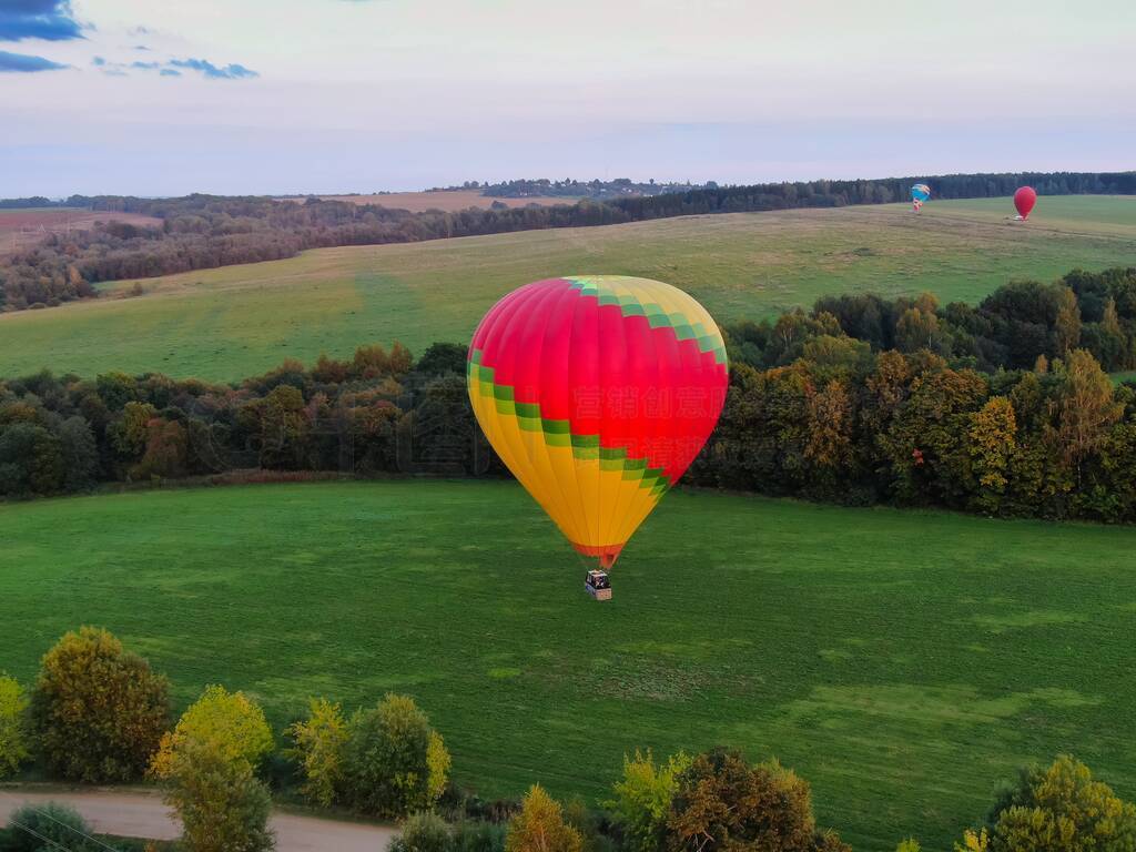 Aerial view of air balloons flights above the river.