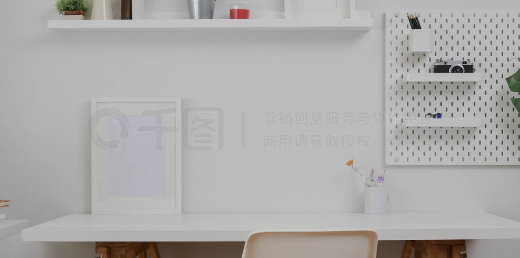 Minimal white workplace with mock up frame and office supplies