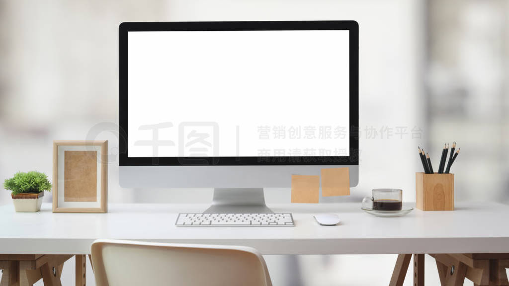 Close up view of workspace with blank screen computer, office su