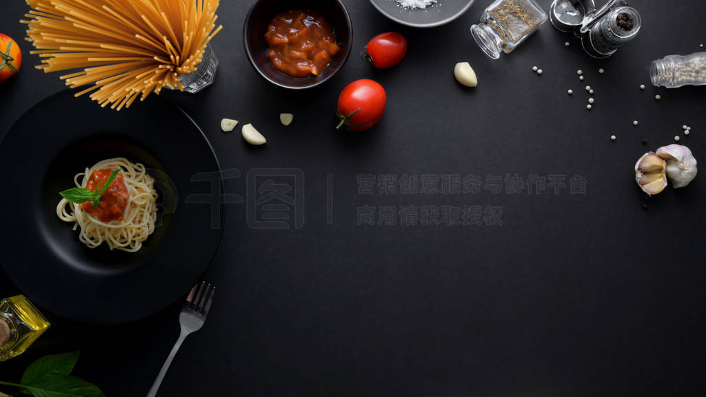 Top view of ingredients of Italian spaghetti pasta with tomato s