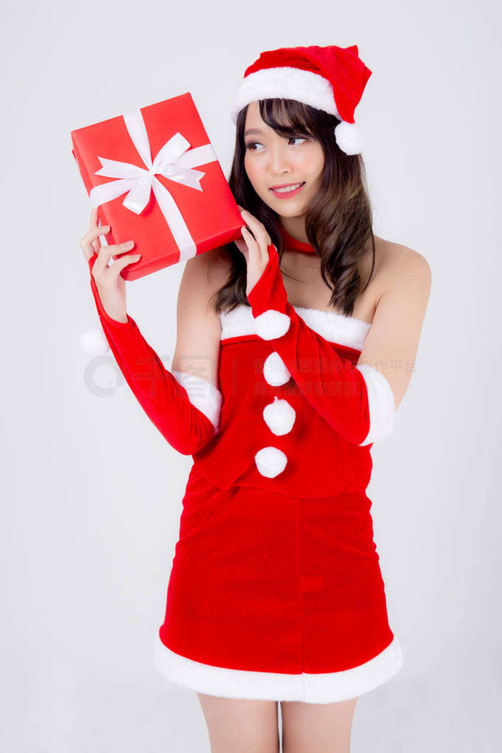 Beautiful portrait young asian woman happy holding red gift box