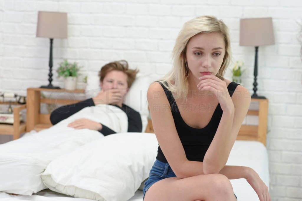 Frustrated sad girlfriend sit on bed think of relationship prob