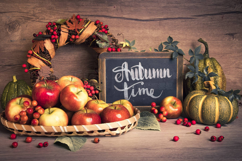 Autumn arrangement with apples, text
