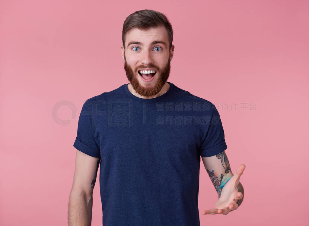 Portrait of young happy amazed attractive red-bearded young guy