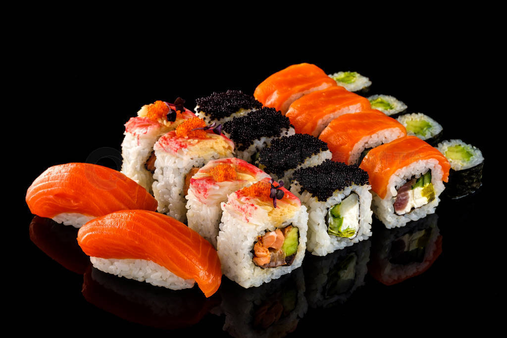 Set sushi roll. Traditional Japanese cuisine. Isolated on black