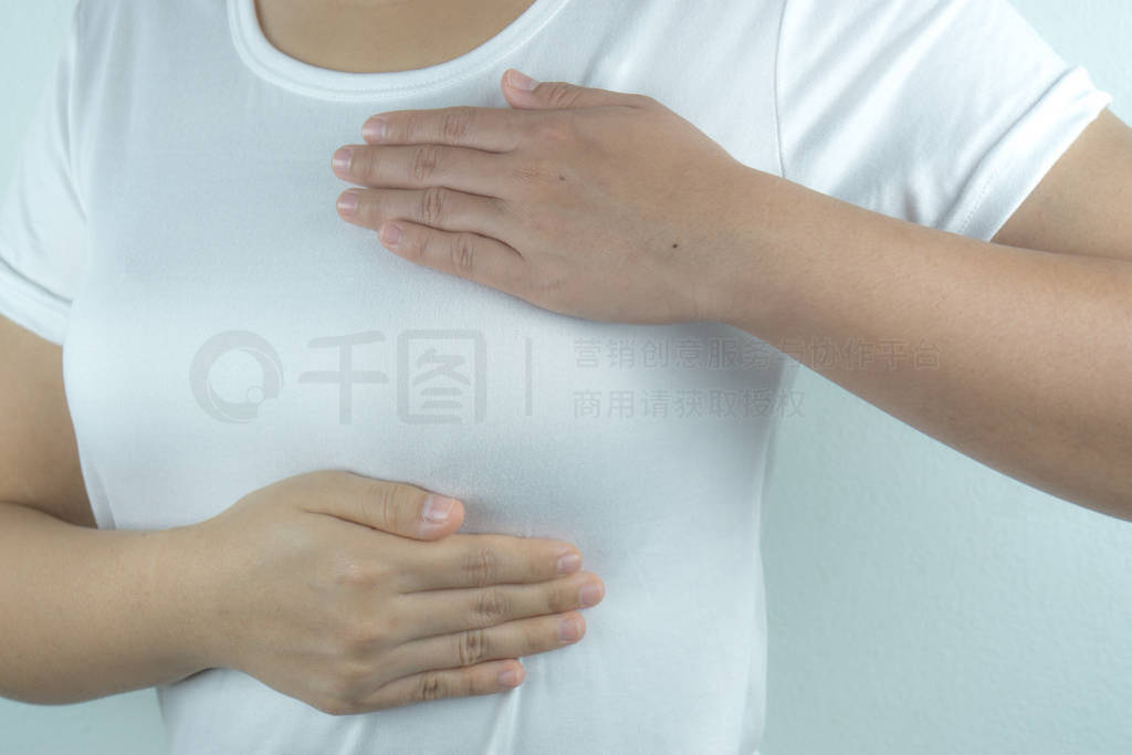 Woman hands doing breast self-exam for checking lumps and signs