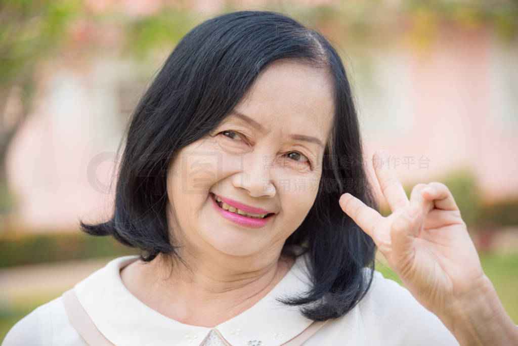 Closeup of beautiful asian senior woman smiling