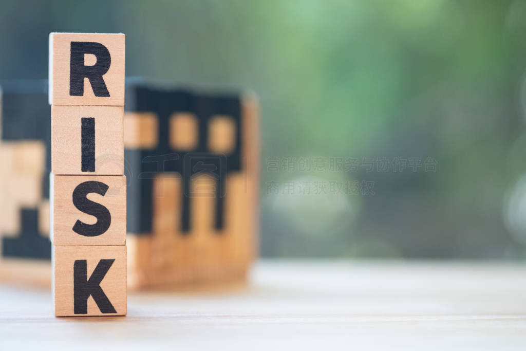 Wood letter block in word risk