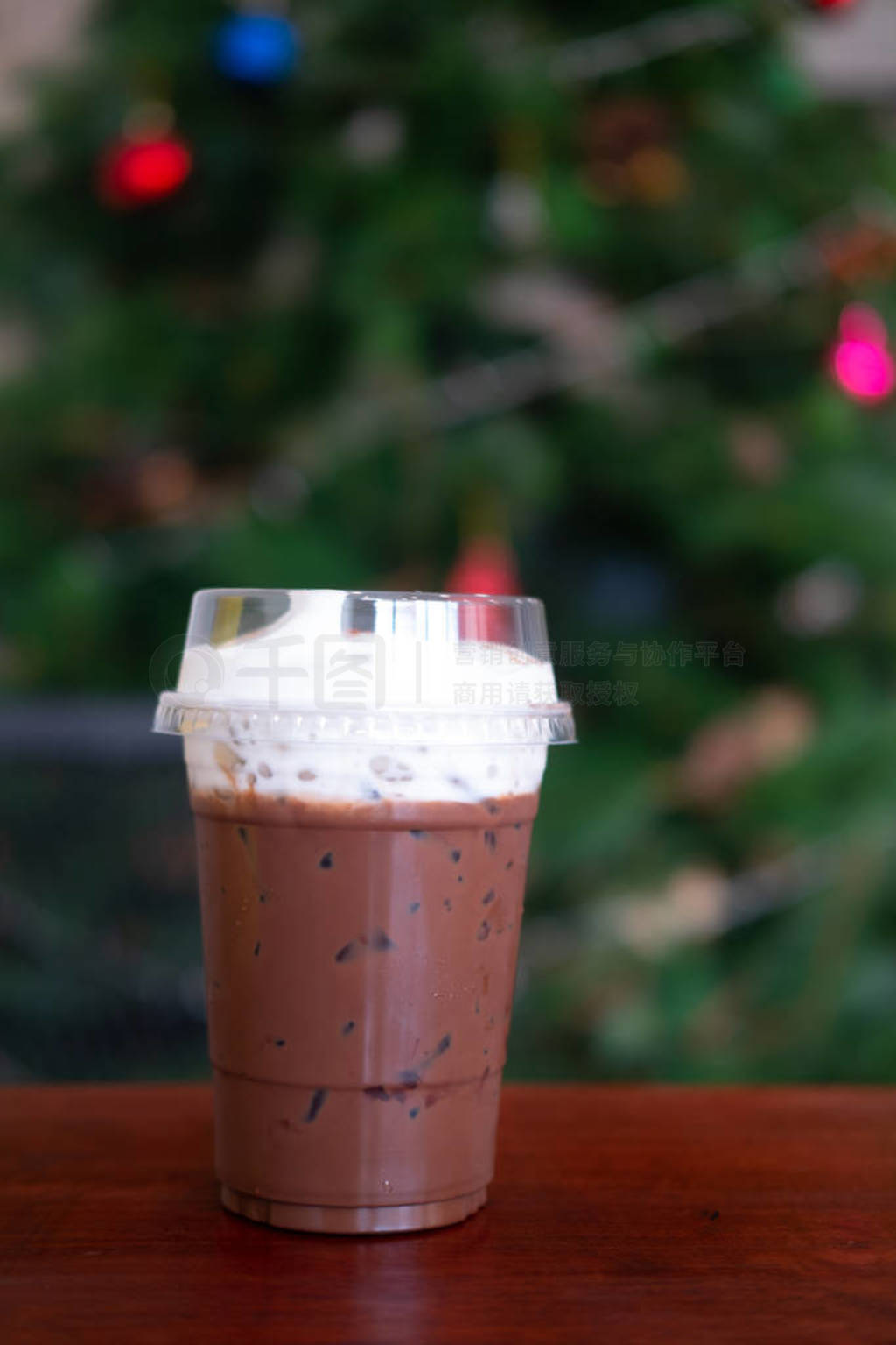 Iced coffee mocha with foam milk in plastic glass