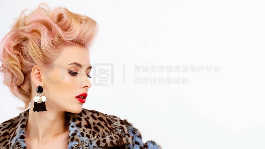 Young woman in fur coat with creative colored hair. Blonde with