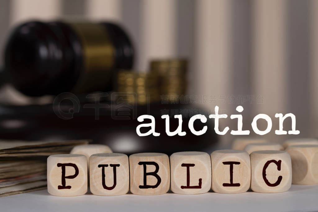 Word PUBLIC AUCTION composed of wooden dices.