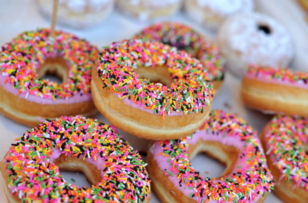 Homemade colorful donuts with chocolate and icing glaze, sweet