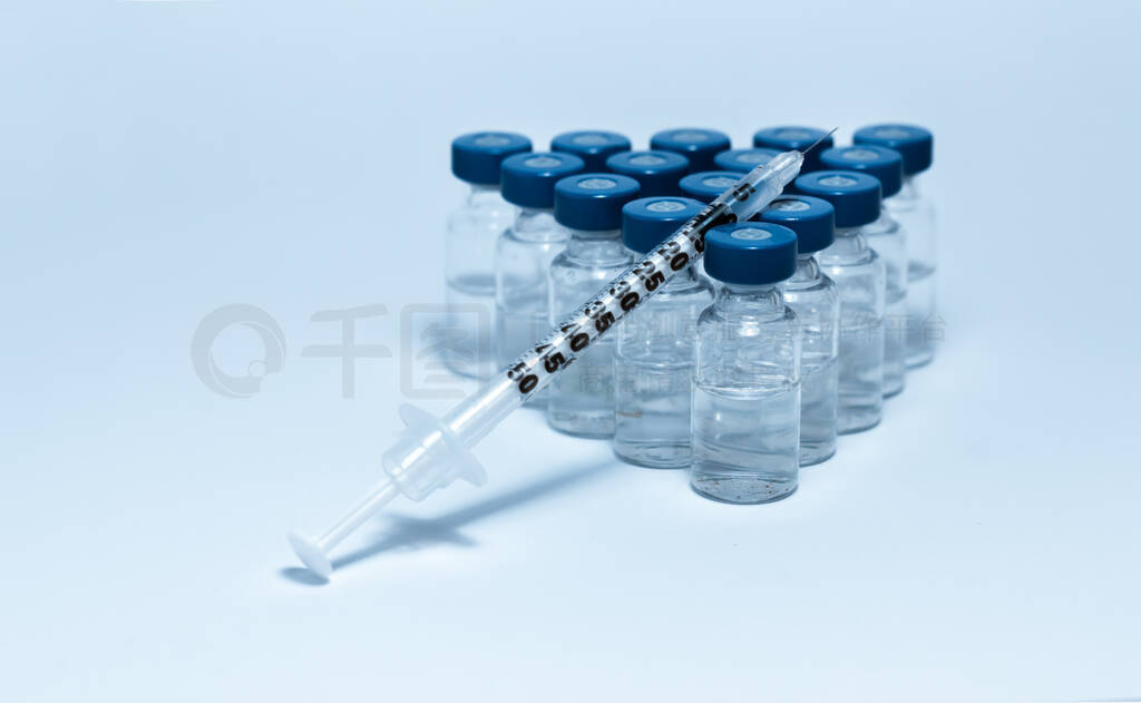 Glass medicine bottles with injection fluid with blue aluminium