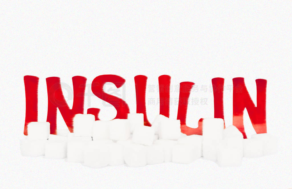 red cardboard insulin word surrounded by refined sugar cubes on