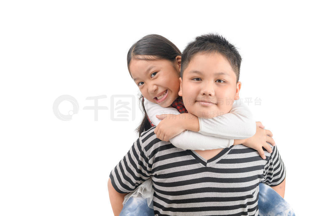 Brother giving piggyback ride to sister isolated on white