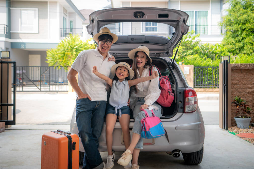 Portrait of Asian family with father, mother and daughter looks