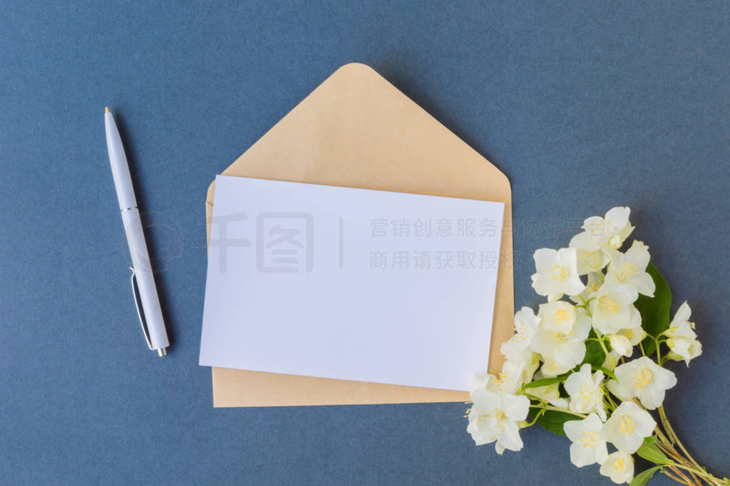 Mockup white greeting card and envelope with white jasmine flowe