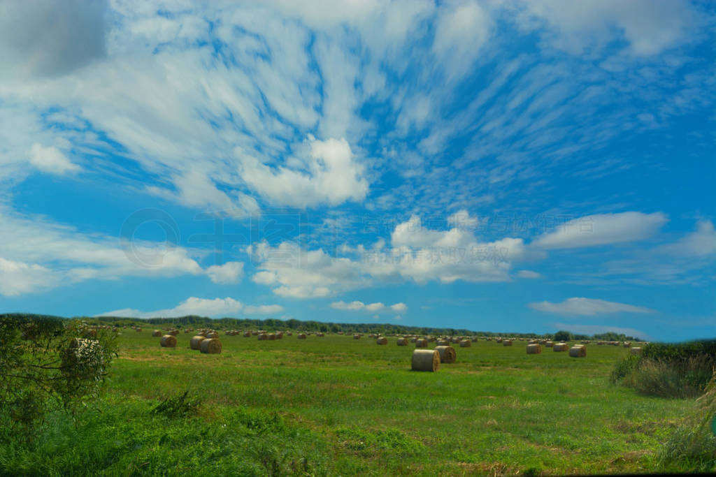 Scenic panorama with hay bales