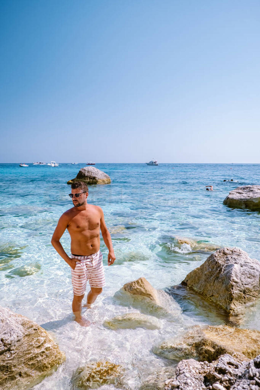 Sardinia Orosei coast Italy, guy on vacation at the Island of Sa