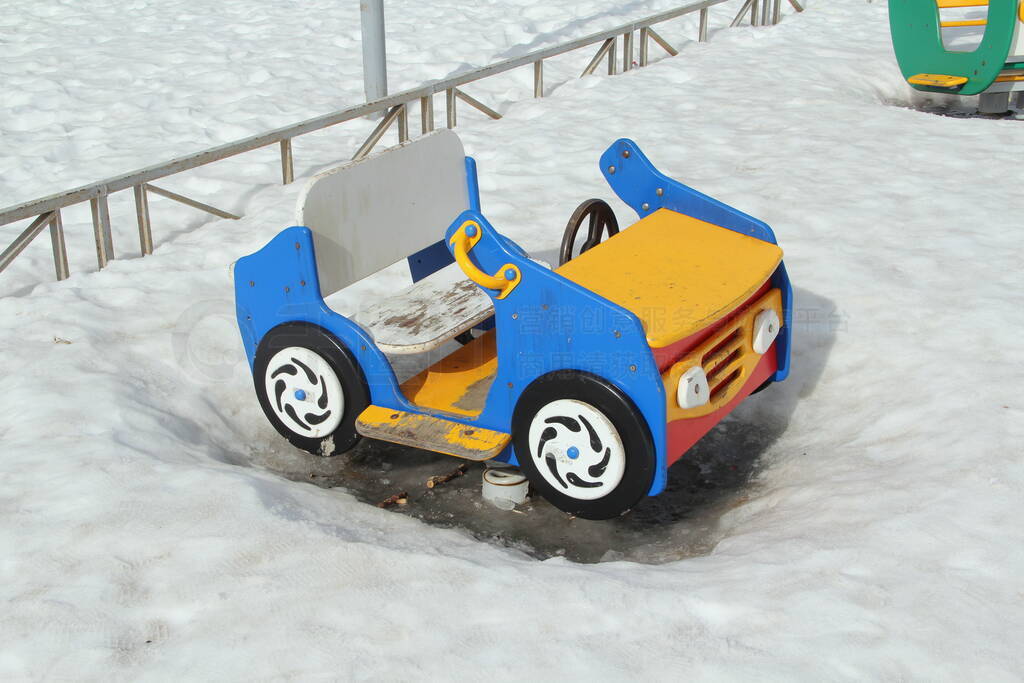 Childrens swing in the form of a car on the playground
