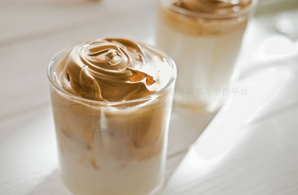 Iced frothy Dalgona Coffee, a trendy fluffy creamy whipped coffe