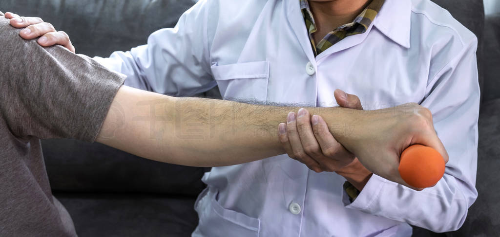 Doctor physiotherapist treating rehabilitation arm pain patient