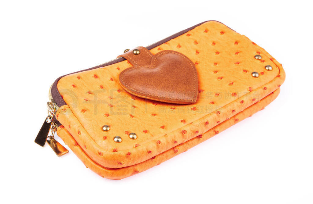 leather wallet with around zip decorate by heart isolated on a