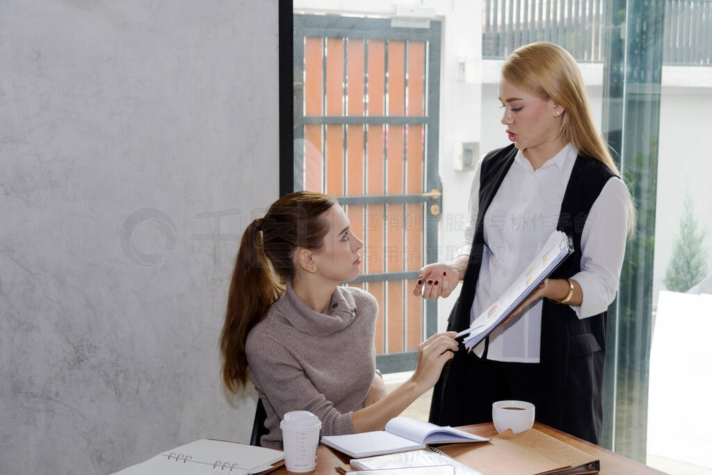 Two women are studying and teaching