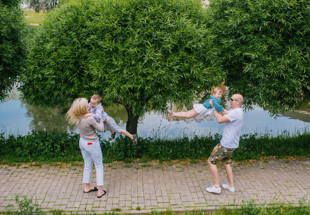 Family lifestyle portrait of a mum and dad with their children h