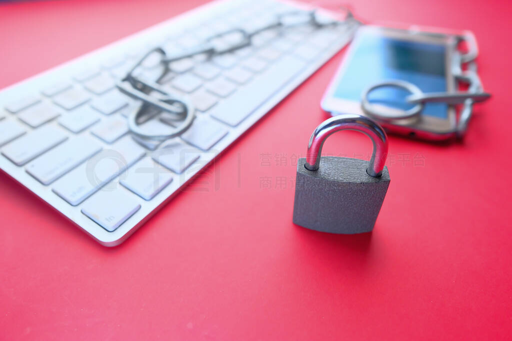 padlock and keyboard on table, cyber security concept