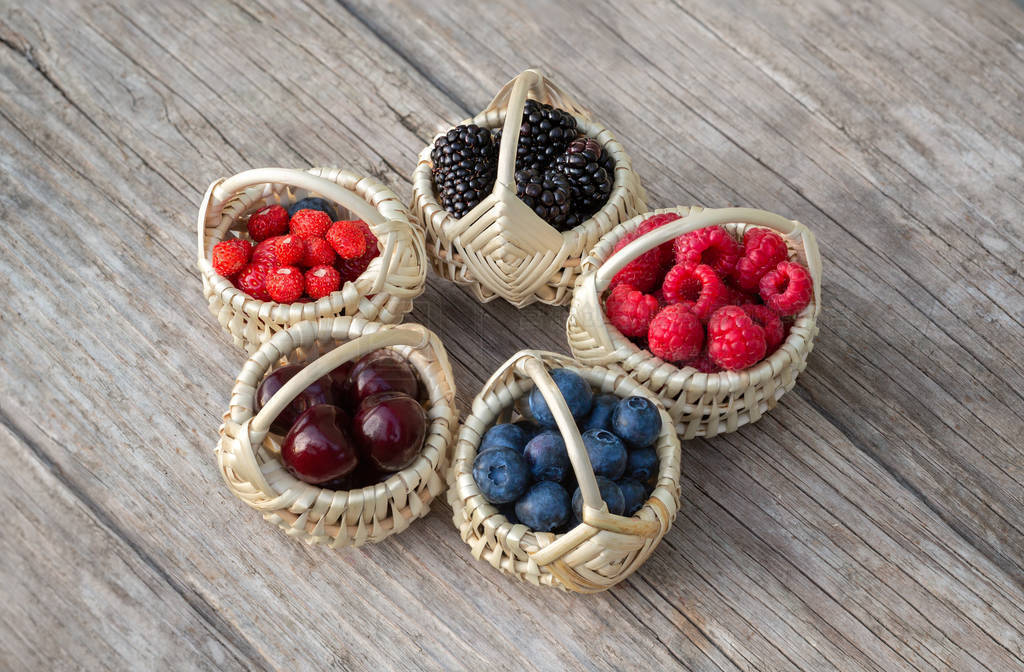 Ripe berries in small baskets
