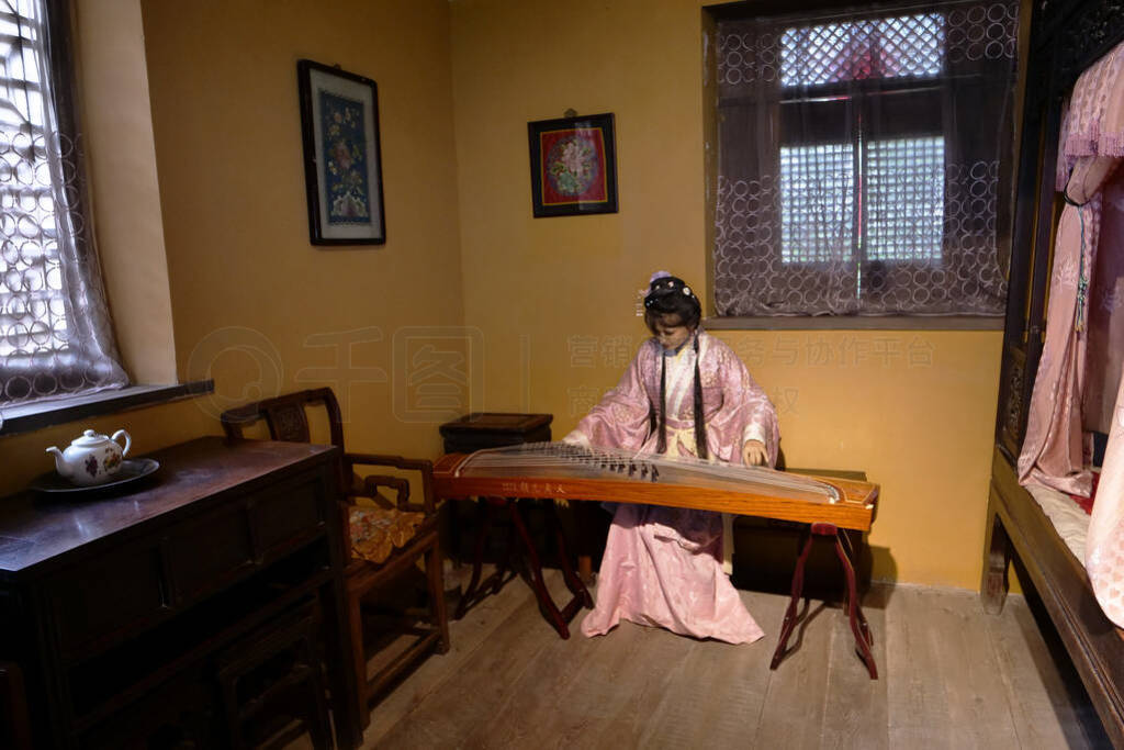 Traditional Chinese Residences mannequin woman playing guqin in