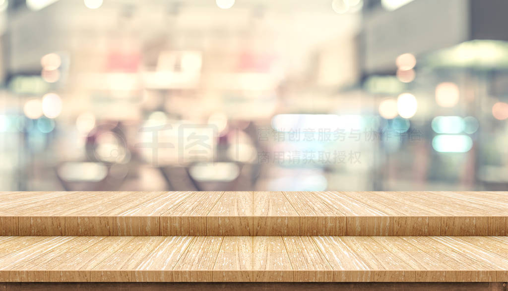 Empty step wood table top ( food stand ) with blur customer dini