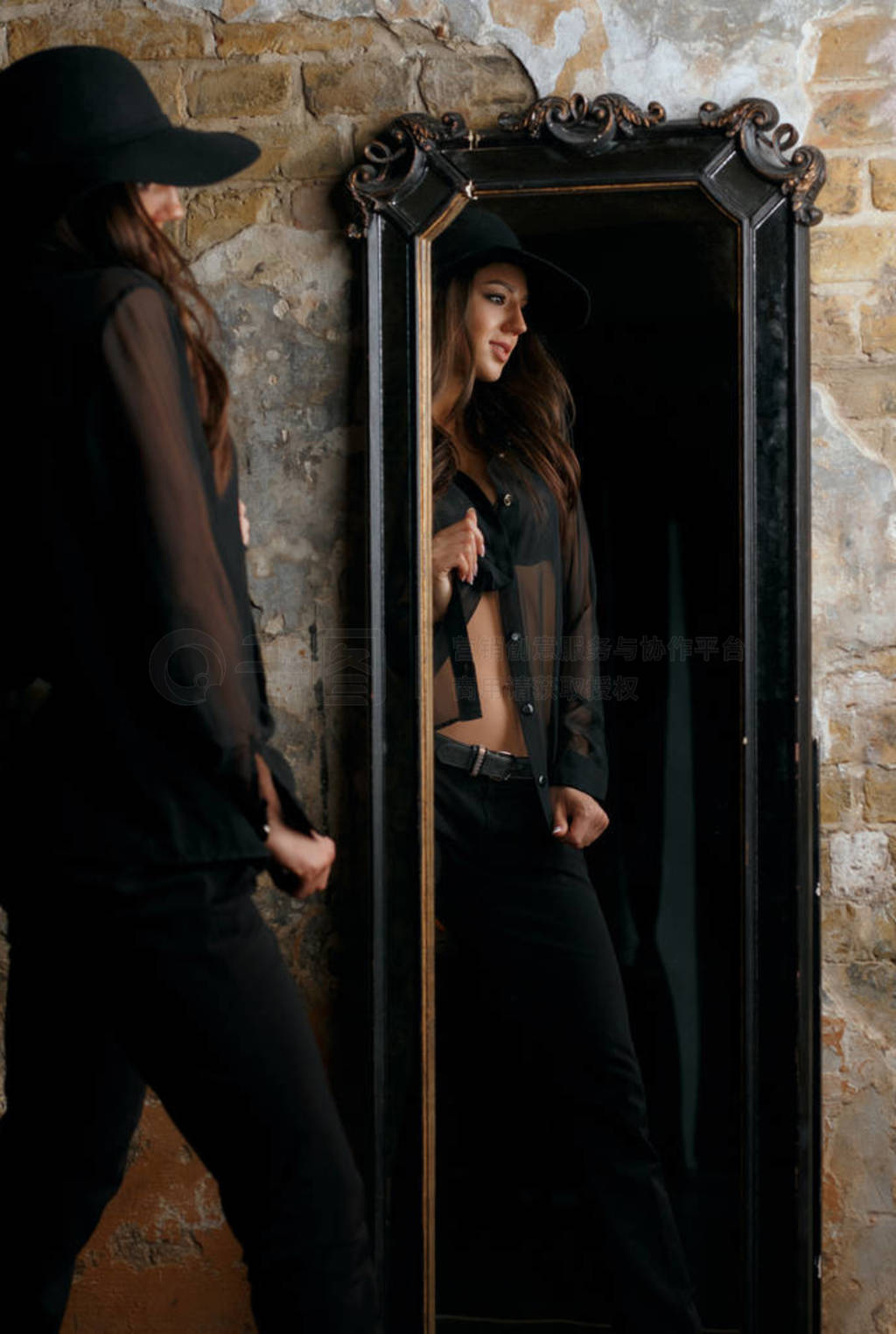 Young fashionable girl wearing stylish black outfit standing at