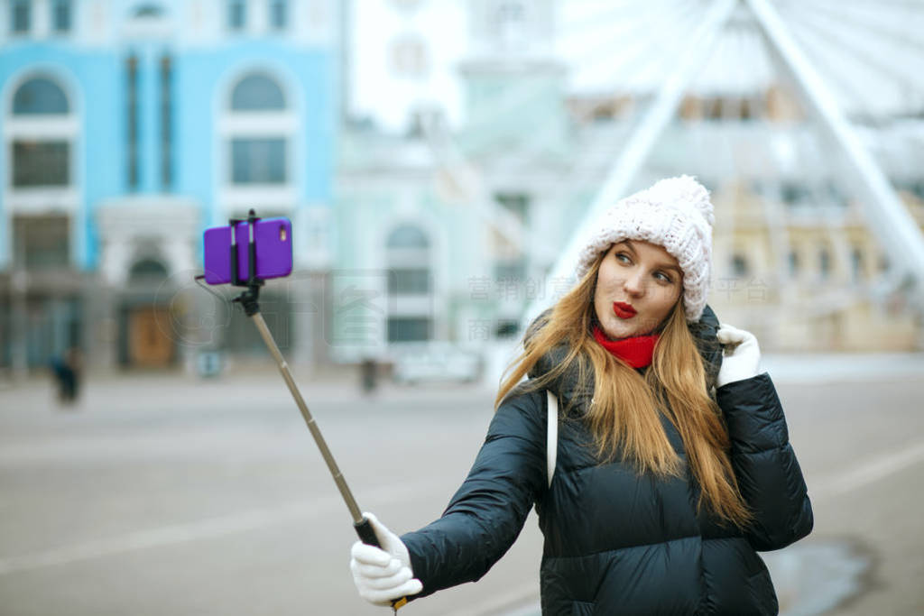 Flirty girl taking self portrait in winter