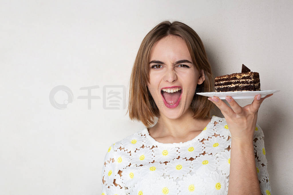 Excited girl holding yummy cake